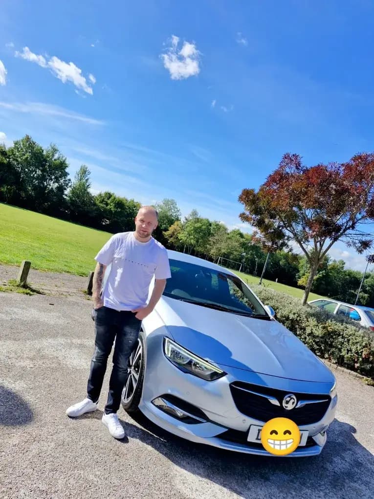 Customer with their Vauxhall Insignia